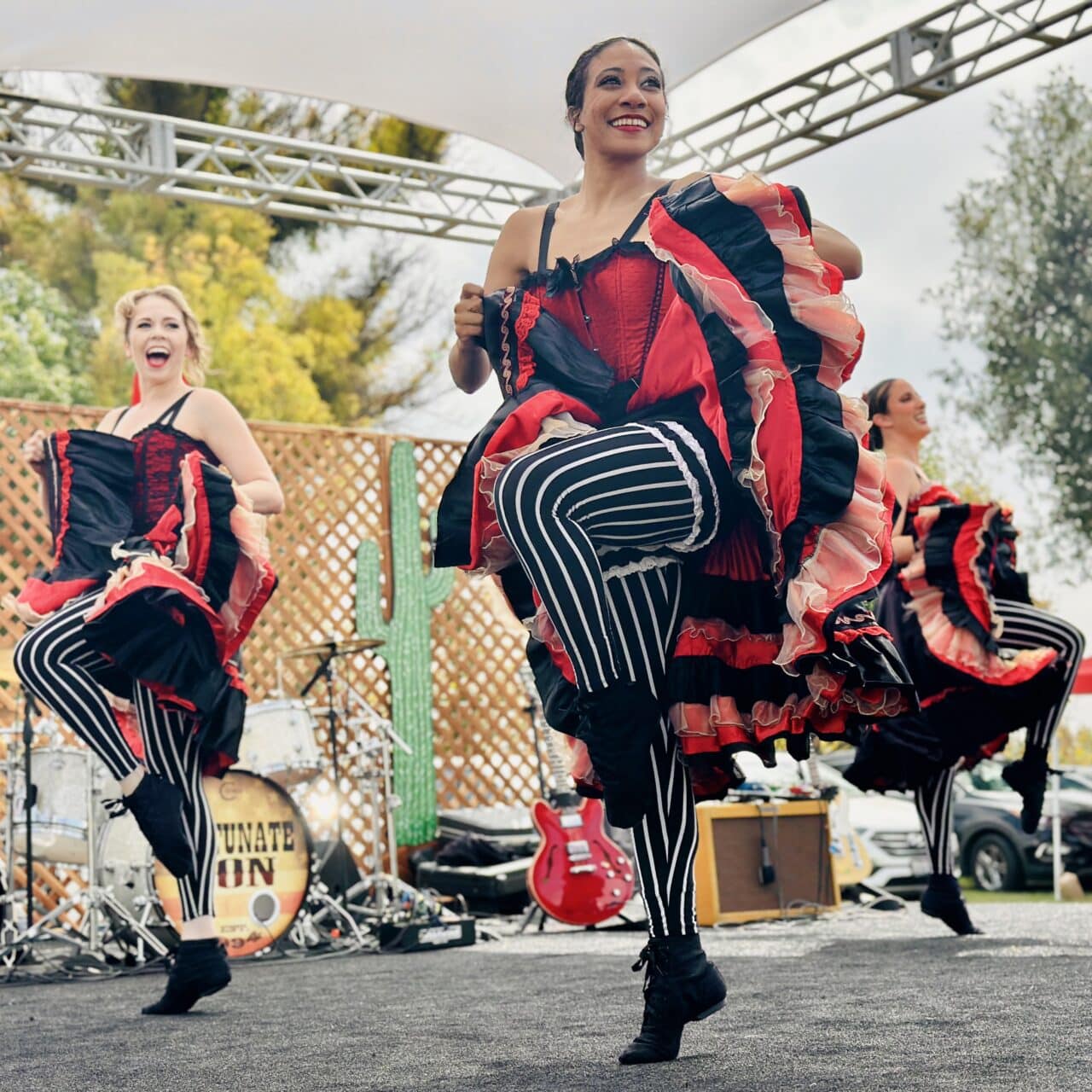 Can Can Dancers perform live on stage at a corporate event outside