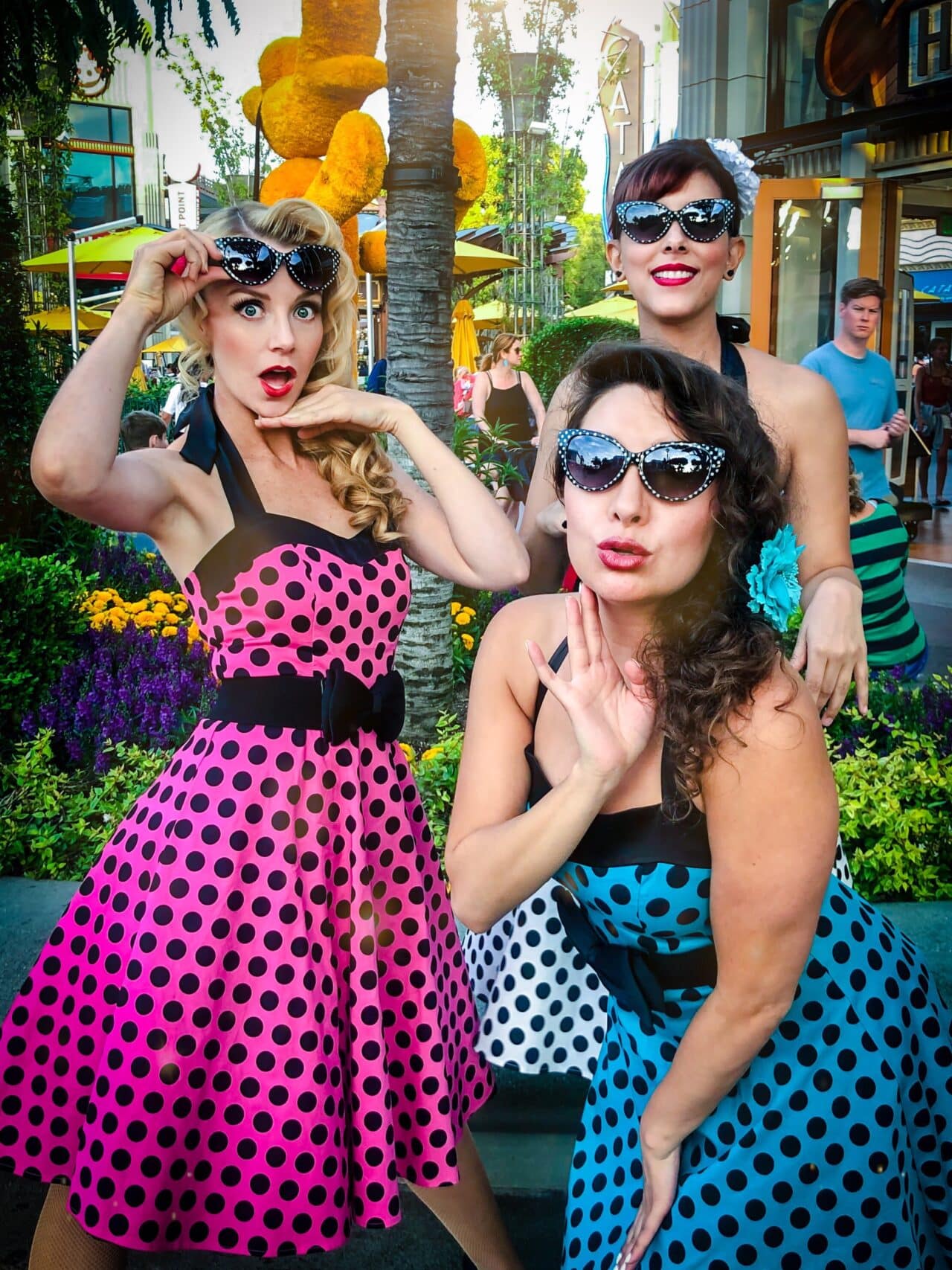 The Sweethearts pose in sunglasses at Disneyland in Anaheim, California