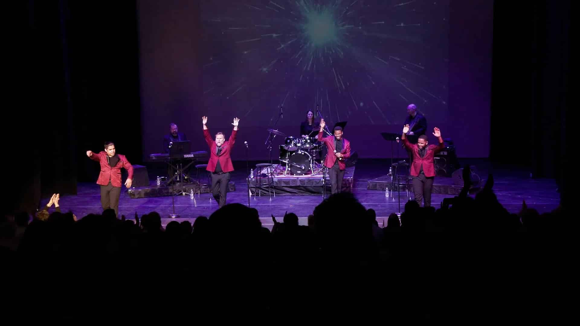 The Suits wave to an enthusiastic crowd at the end of their show in New York City